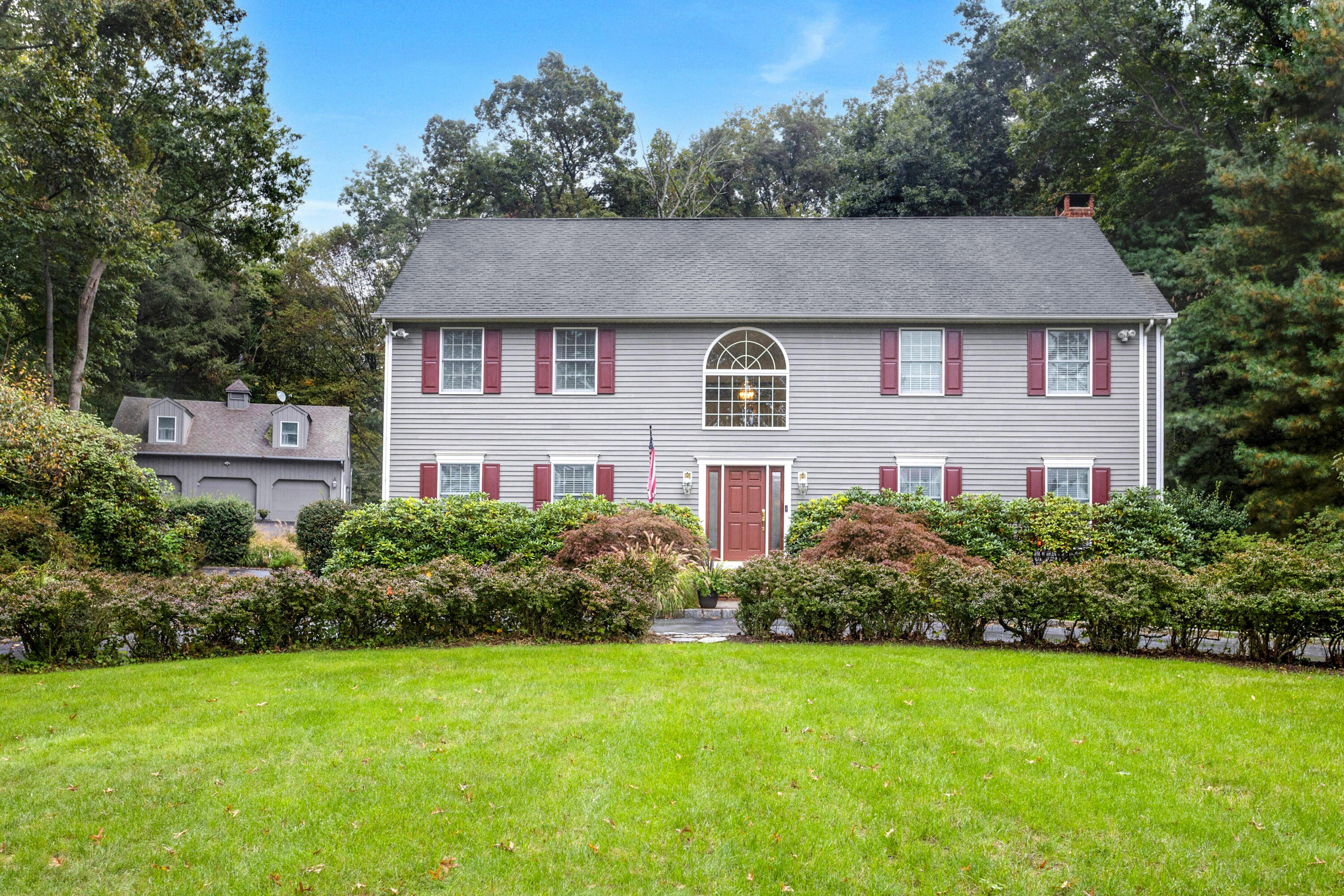 a front view of a house with a yard