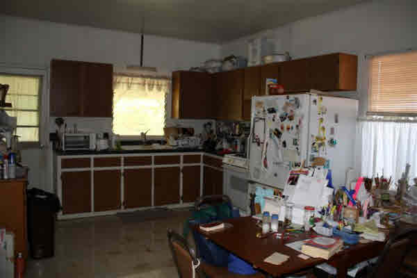 8399 Elepaio Road Kekaha, HI 96752 - Photo 2 of 8 a room with furniture a flat screen tv and a window