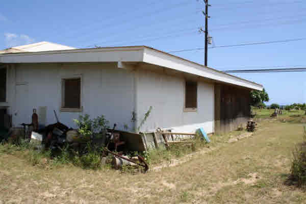 8399 Elepaio Road Kekaha, HI 96752 - Photo 3 of 8 a backyard of a house with table and chairs