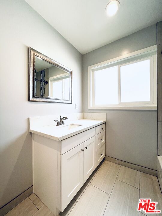 1116 San Rafael Avenue, Unit 1 Glendale, CA 91202 - Photo 29 of 33 a bathroom with a sink and a mirror