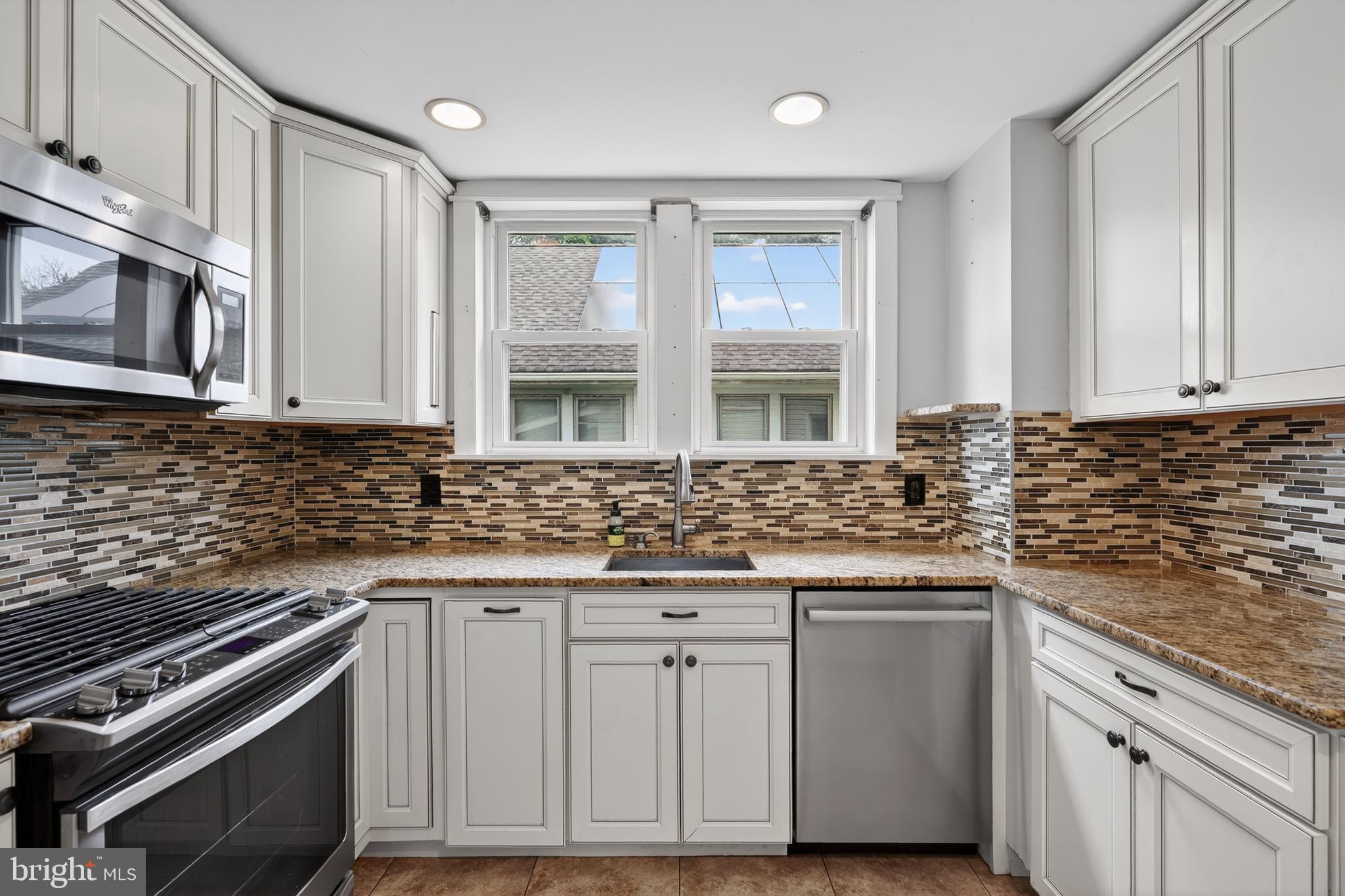 106 Ford Street Voorhees, NJ 08043 - Photo 16 of 36 a kitchen with stainless steel appliances granite countertop a stove and a sink