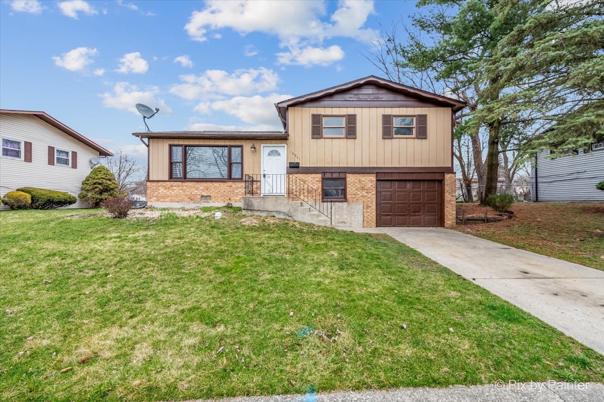 18951 Chestnut Avenue Country Club Hills, IL 60478 - Photo 1 of 23 a front view of a house with a yard and trees
