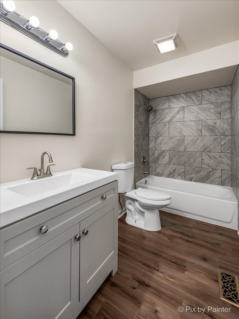 18951 Chestnut Avenue Country Club Hills, IL 60478 - Photo 11 of 23 a bathroom with a double vanity sink mirror and toilet