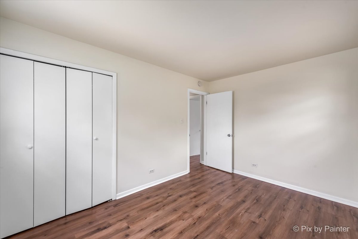 18951 Chestnut Avenue Country Club Hills, IL 60478 - Photo 15 of 23 a view of an empty room with wooden floor