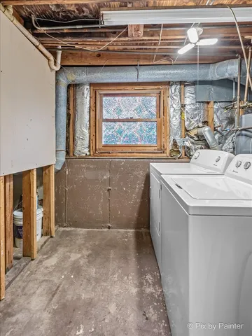 a utility room with a sink dryer and washer