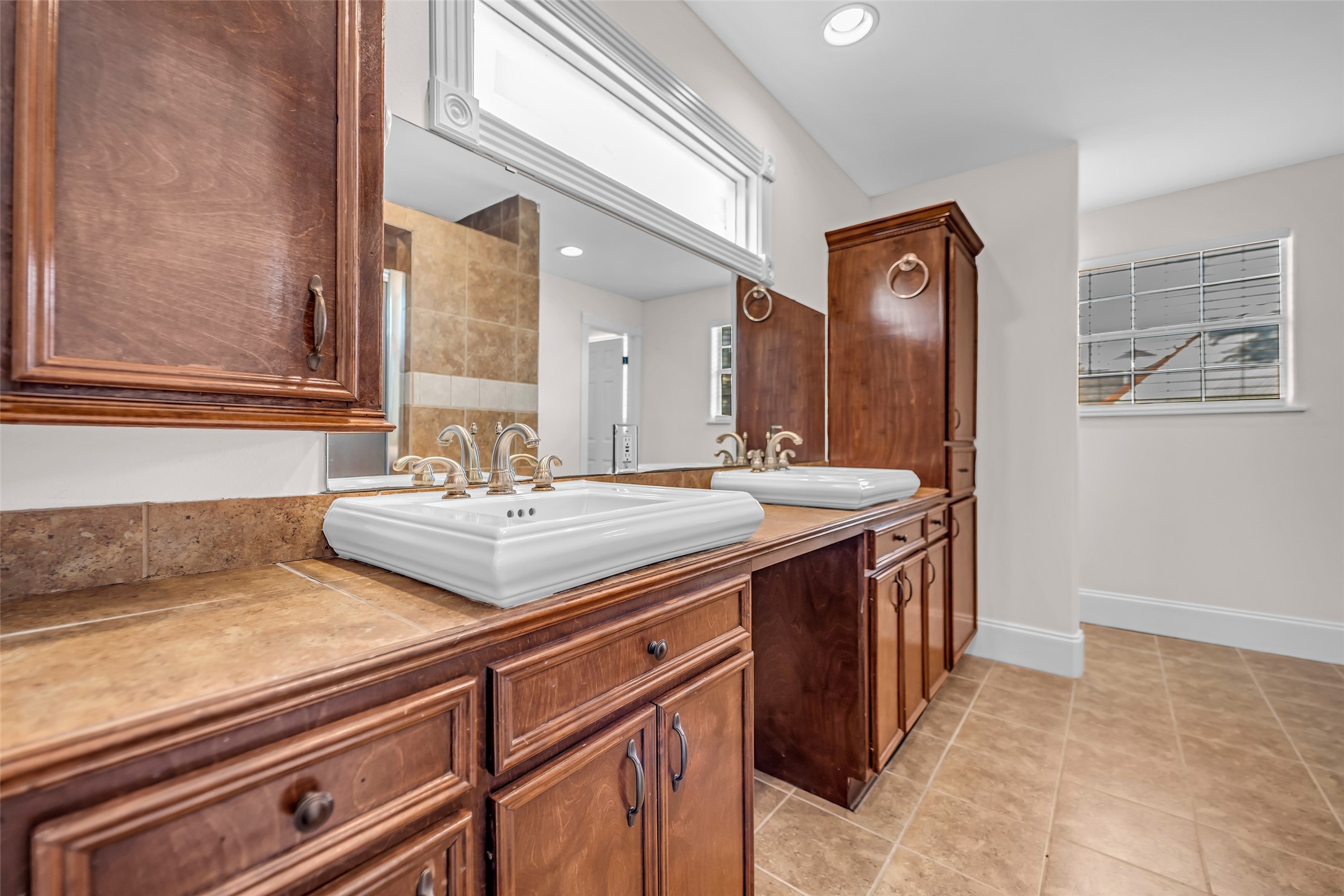 1300 7th Street Rosenberg, TX 77471 - Photo 16 of 42 Primary bathroom with double sink and shower.