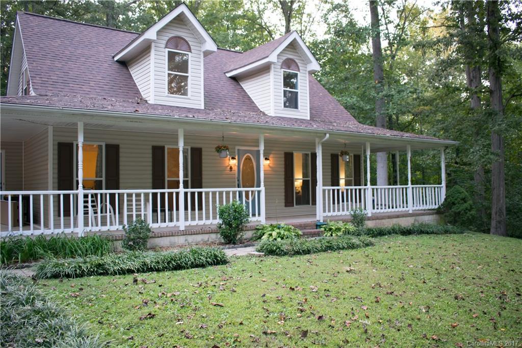 9205 Ladson Road Indian Land, SC 29707 - Photo 2 of 16 a front view of a house with garden