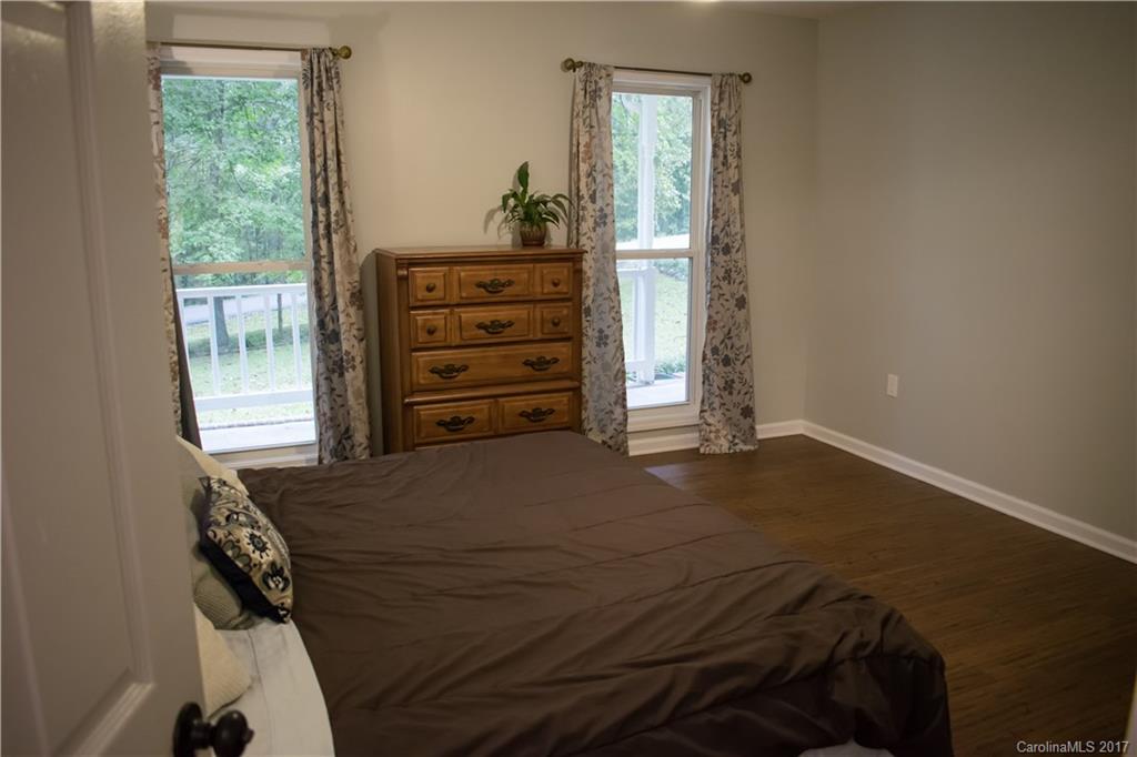9205 Ladson Road Indian Land, SC 29707 - Photo 11 of 16 a bedroom with a bed and a window