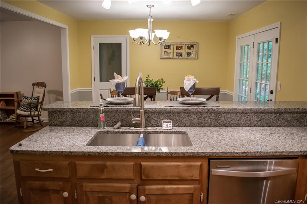 9205 Ladson Road Indian Land, SC 29707 - Photo 7 of 16 a kitchen with a sink and a refrigerator