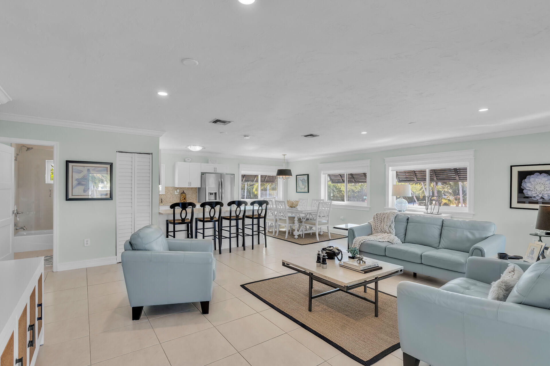 341 Sombrero Beach Road Marathon, FL 33050 - Photo 25 of 44 a living room with furniture and a glass door