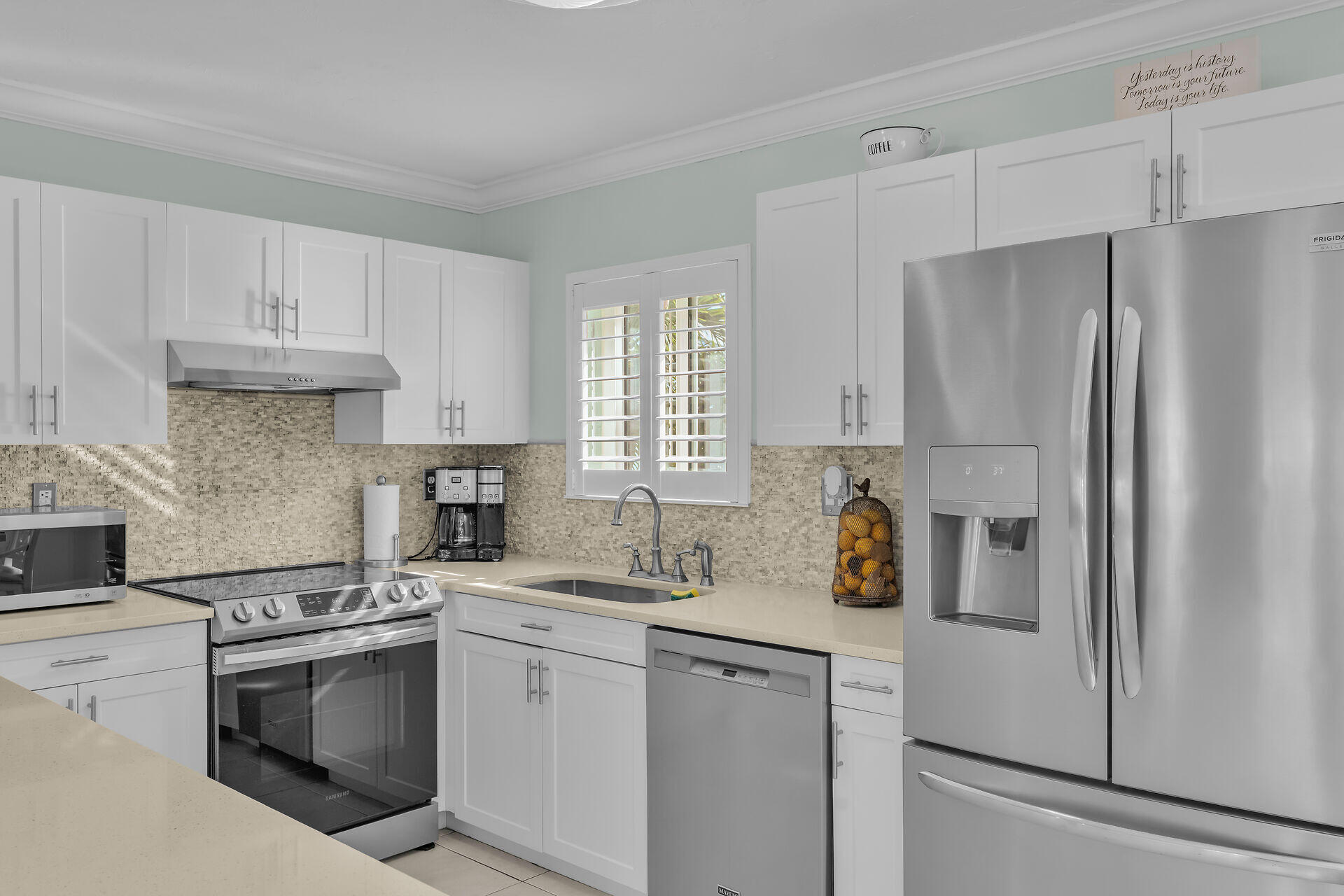 341 Sombrero Beach Road Marathon, FL 33050 - Photo 33 of 44 a kitchen with stainless steel appliances a refrigerator sink and cabinets