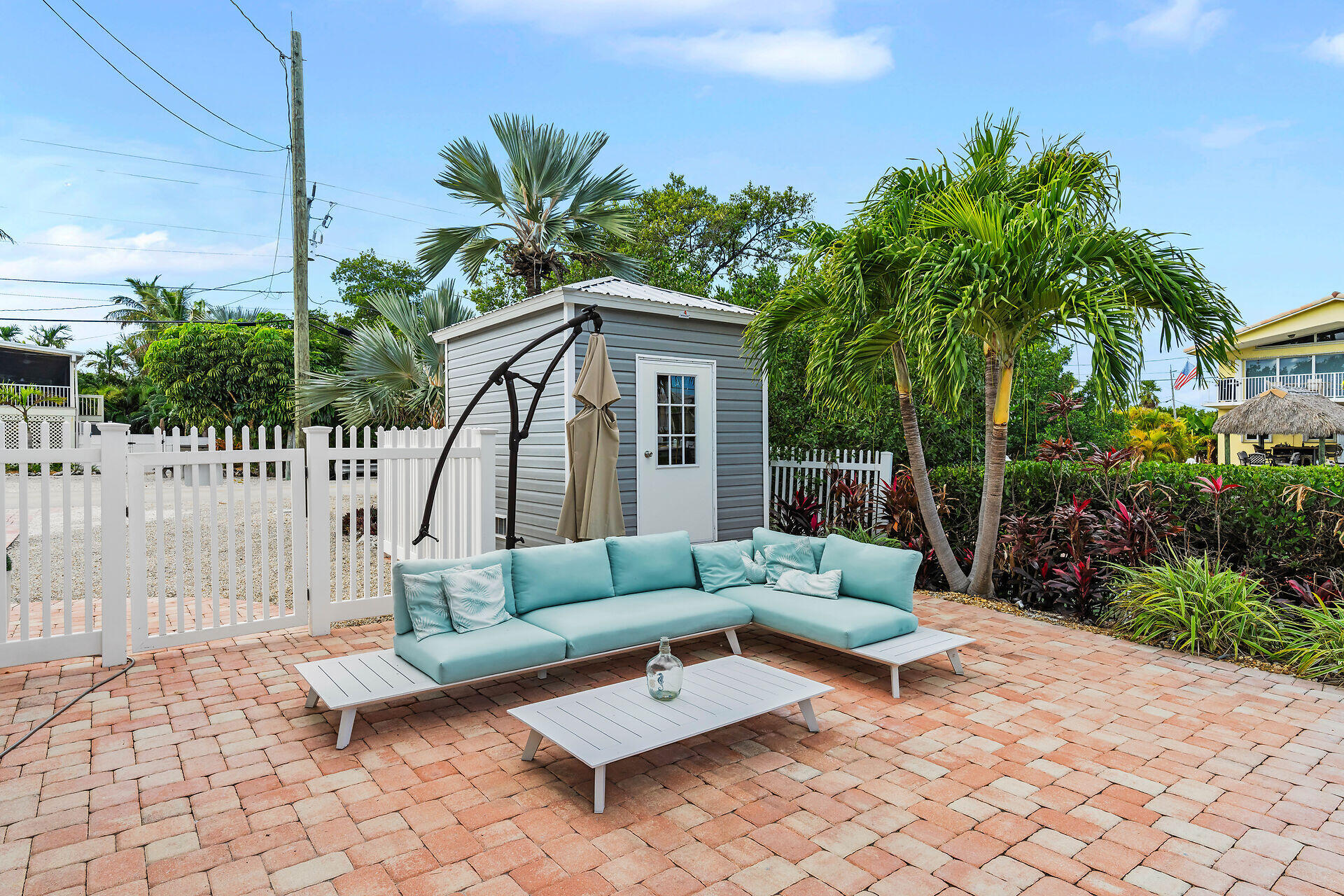 341 Sombrero Beach Road Marathon, FL 33050 - Photo 9 of 44 a building outdoor space with patio couch and potted plants