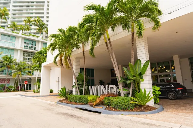 a view of a palm trees in front of a building