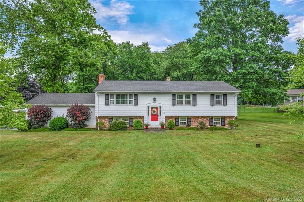162 Mungertown Road Madison, CT 06443 - Photo 1 of 1 a view of a house with a yard and sitting area