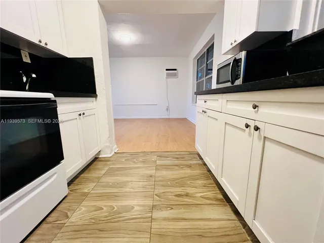 a view of a kitchen from the hallway