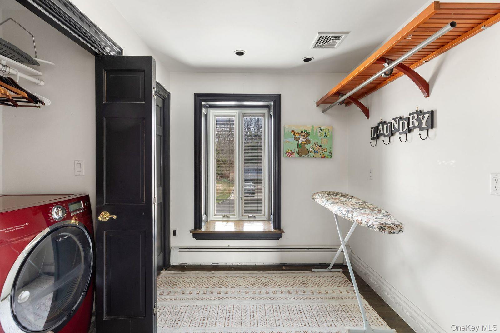 33 Beach Road Northport, NY 11768 - Photo 31 of 50 a view of a hallway with washer and dryer