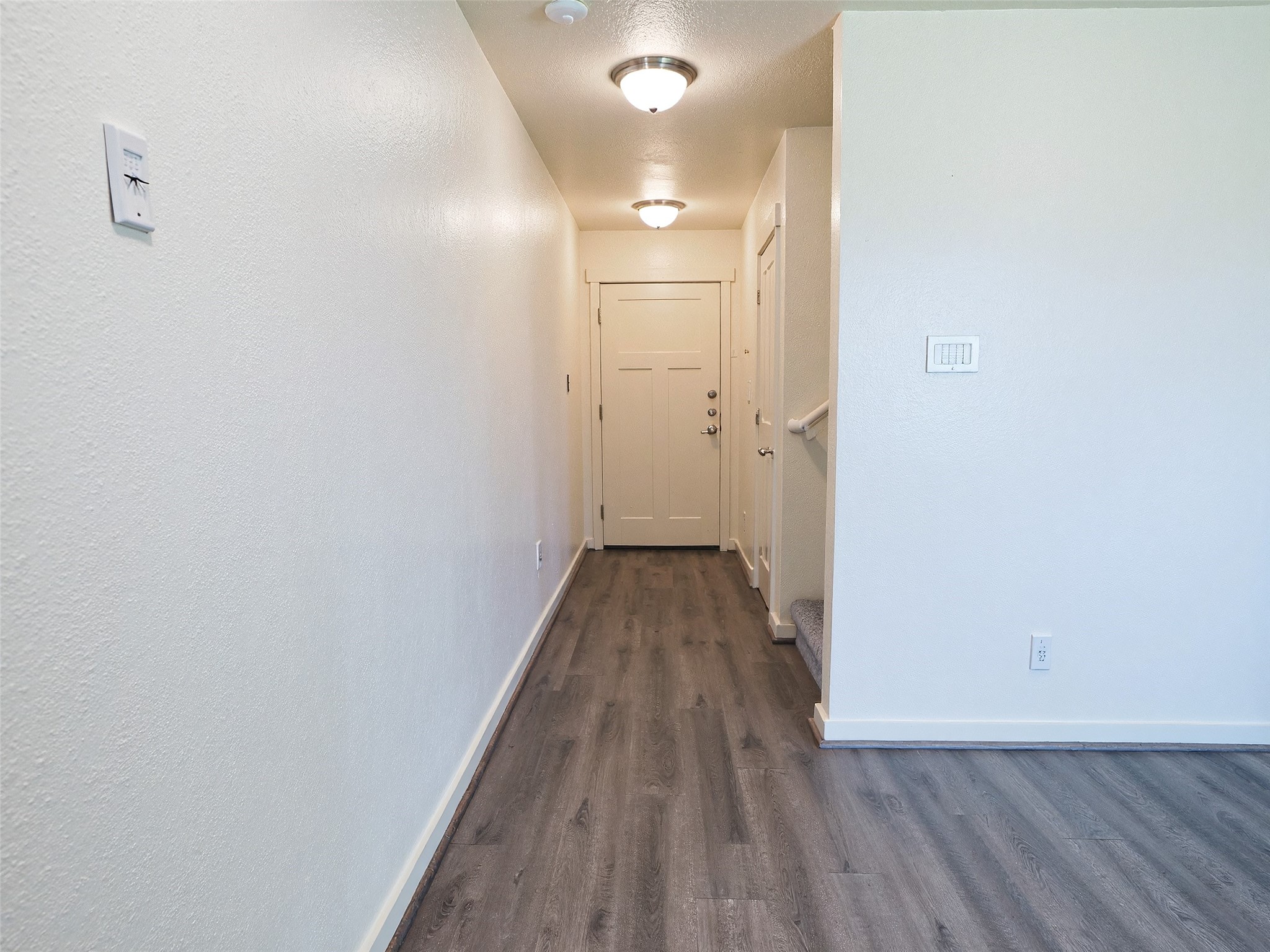 21155 Gosling Road, Unit 7D Spring, TX 77388 - Photo 3 of 24 a view of a hallway with wooden floor