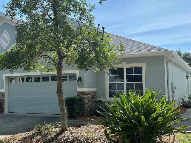 a house with a tree in front of it