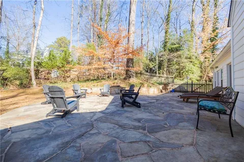 a view of a house with a yard covered with snow in the yard