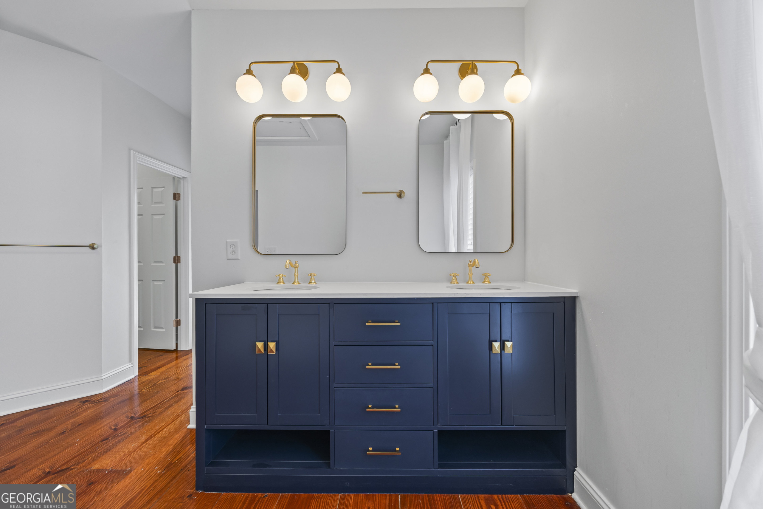 1270 Swords Road Greensboro, GA 30642 - Photo 19 of 41 a bathroom with double vanity sinks and a mirror