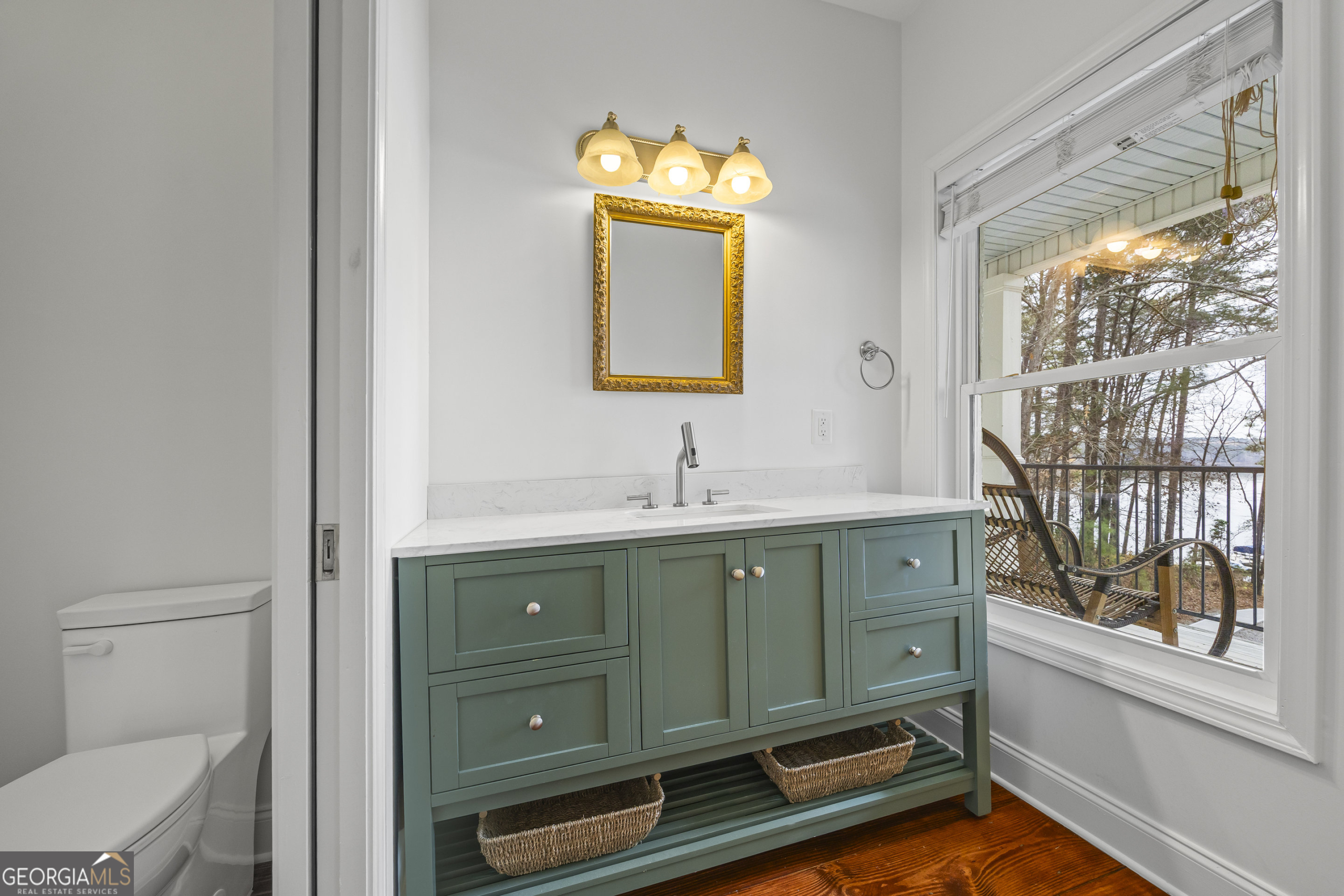 1270 Swords Road Greensboro, GA 30642 - Photo 23 of 41 a bathroom with a sink and a mirror