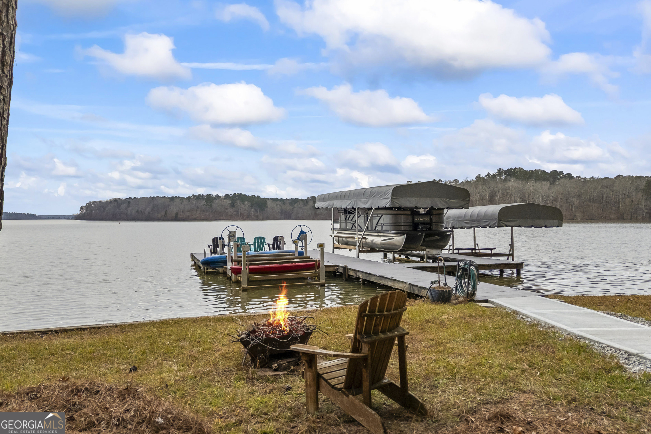 1270 Swords Road Greensboro, GA 30642 - Photo 3 of 41 a view of a lake with table and chairs