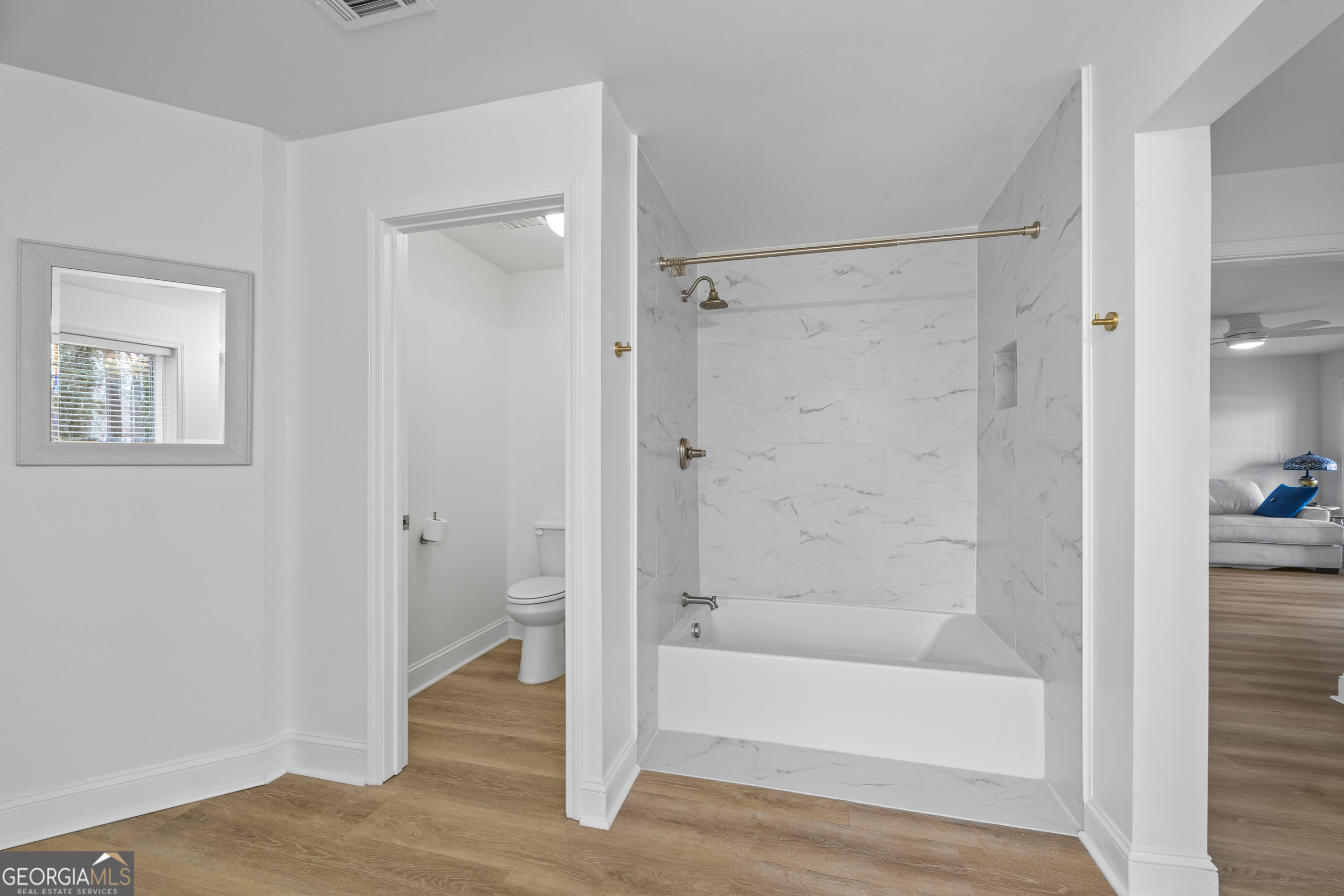 1270 Swords Road Greensboro, GA 30642 - Photo 32 of 41 a bathroom with a bathtub and a shower