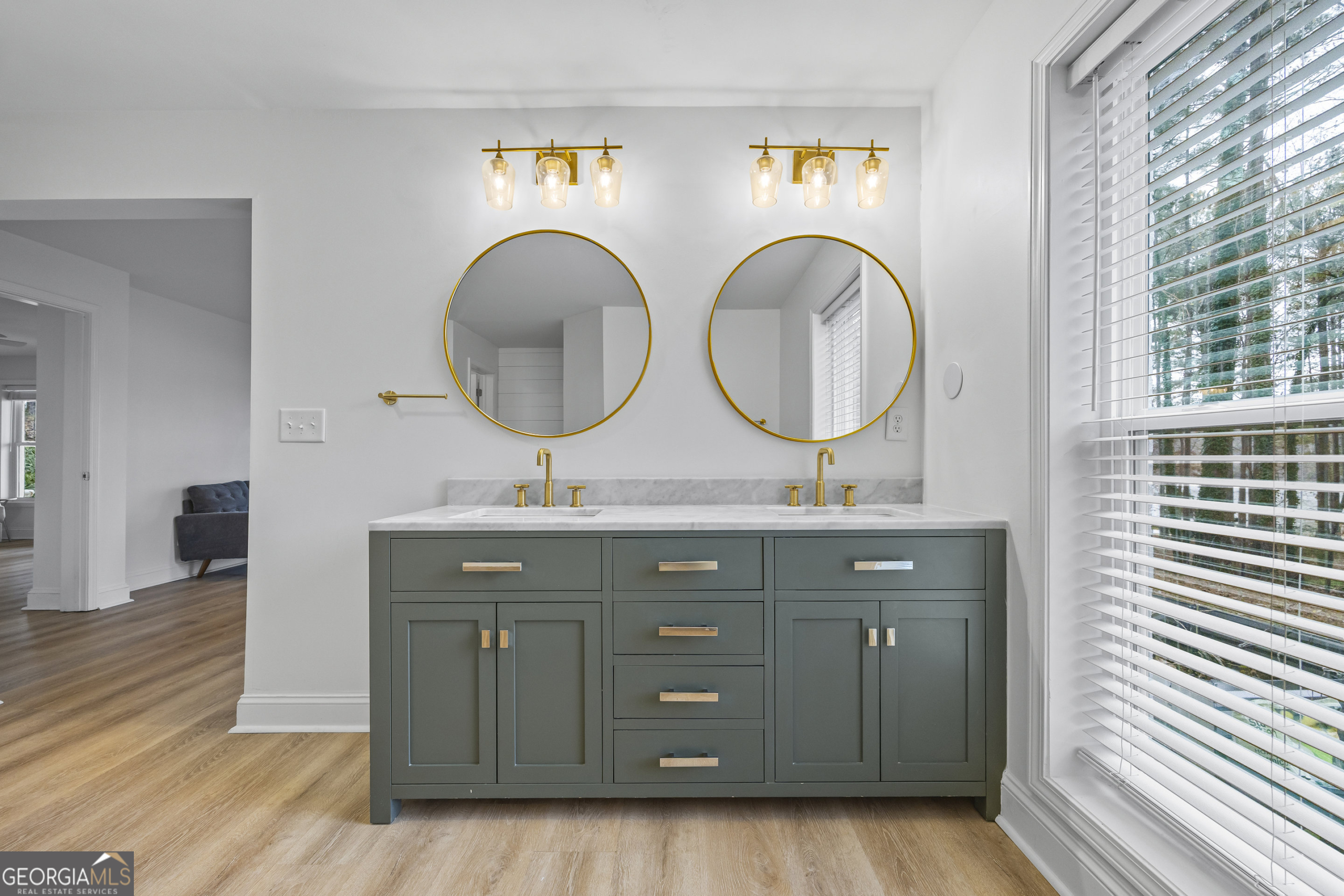 1270 Swords Road Greensboro, GA 30642 - Photo 33 of 41 a bathroom with a double vanity sink and a mirror