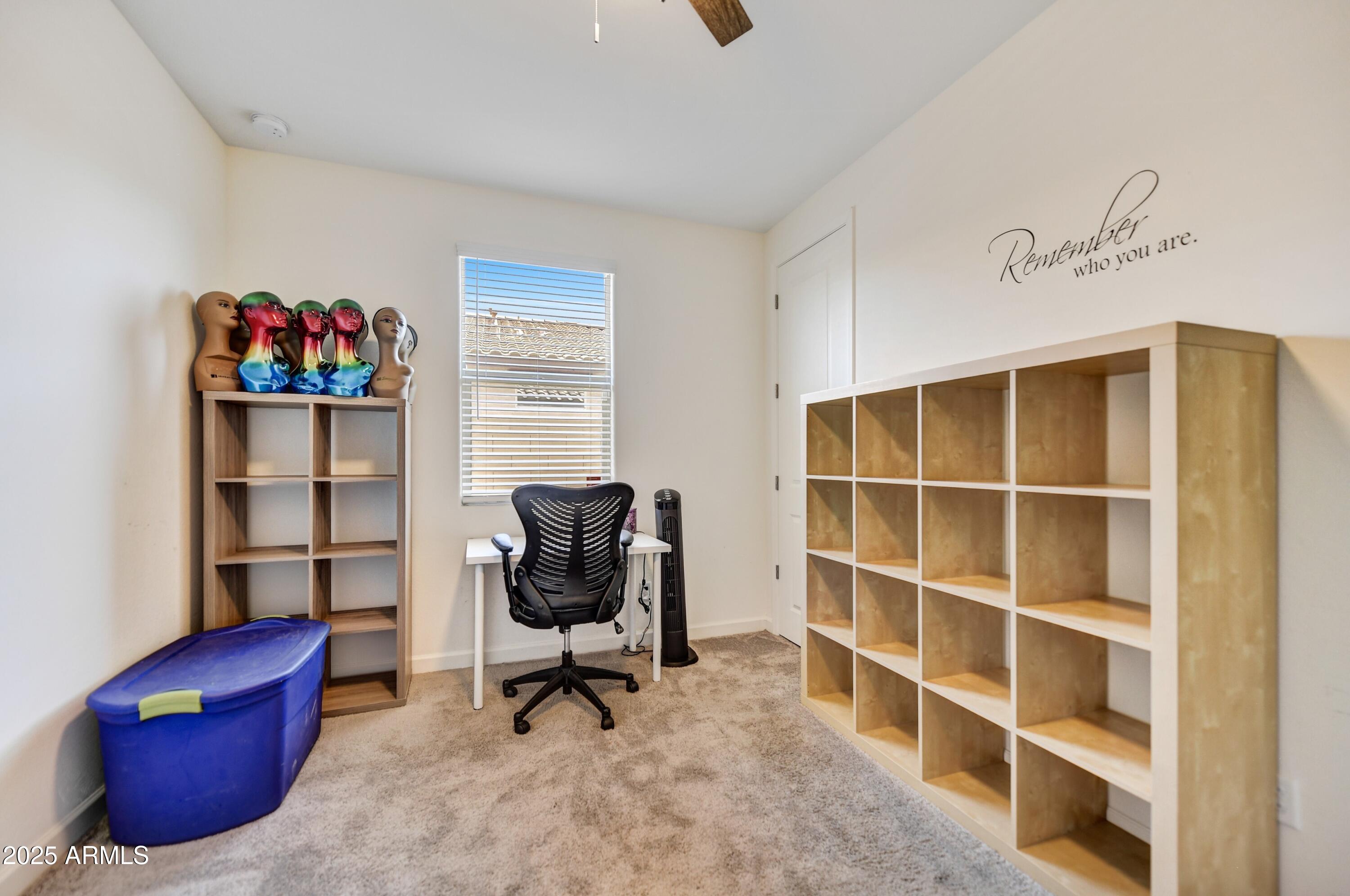 2745 West Pollack Street Phoenix, AZ 85041 - Photo 12 of 20 a view of a workspace with furniture and a workspace