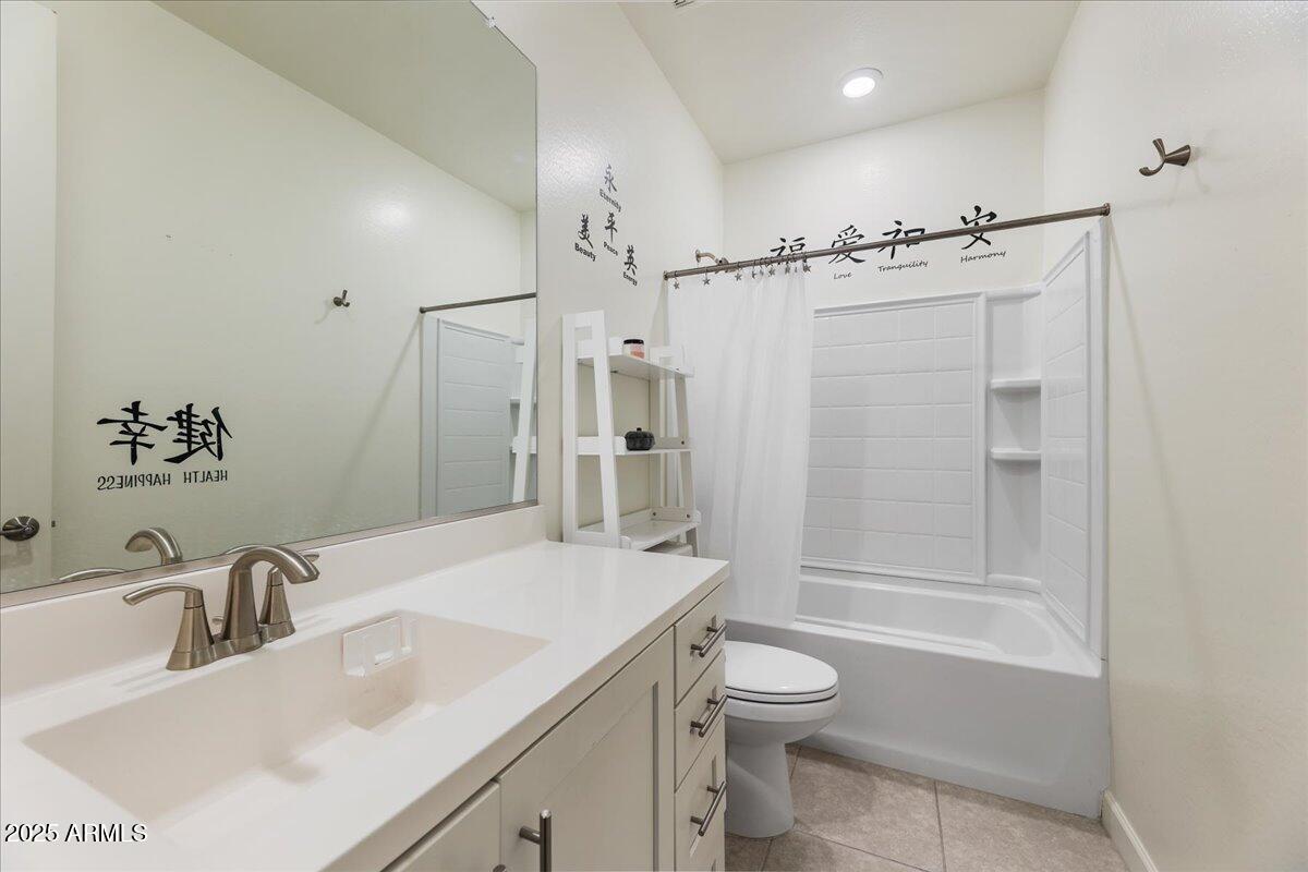 2745 West Pollack Street Phoenix, AZ 85041 - Photo 15 of 20 a bathroom with a sink toilet tub and shower