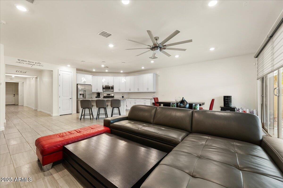 2745 West Pollack Street Phoenix, AZ 85041 - Photo 3 of 20 a living room with furniture and a view of kitchen