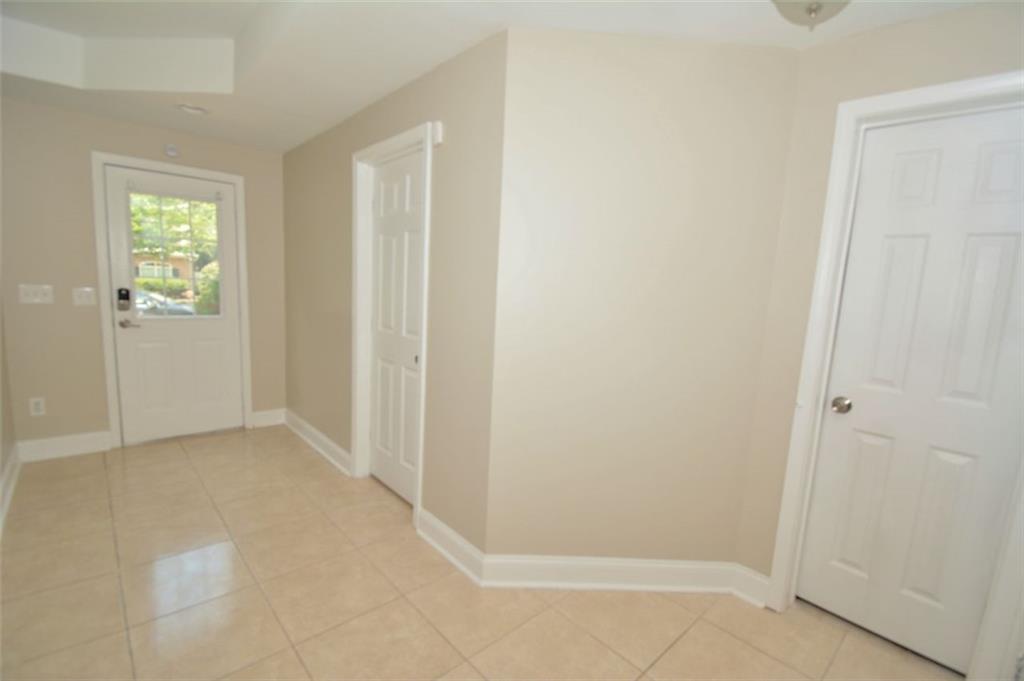 618 Tradwell Place Northeast, Unit BSMT Dacula, GA 30019 - Photo 17 of 20 an empty room with windows
