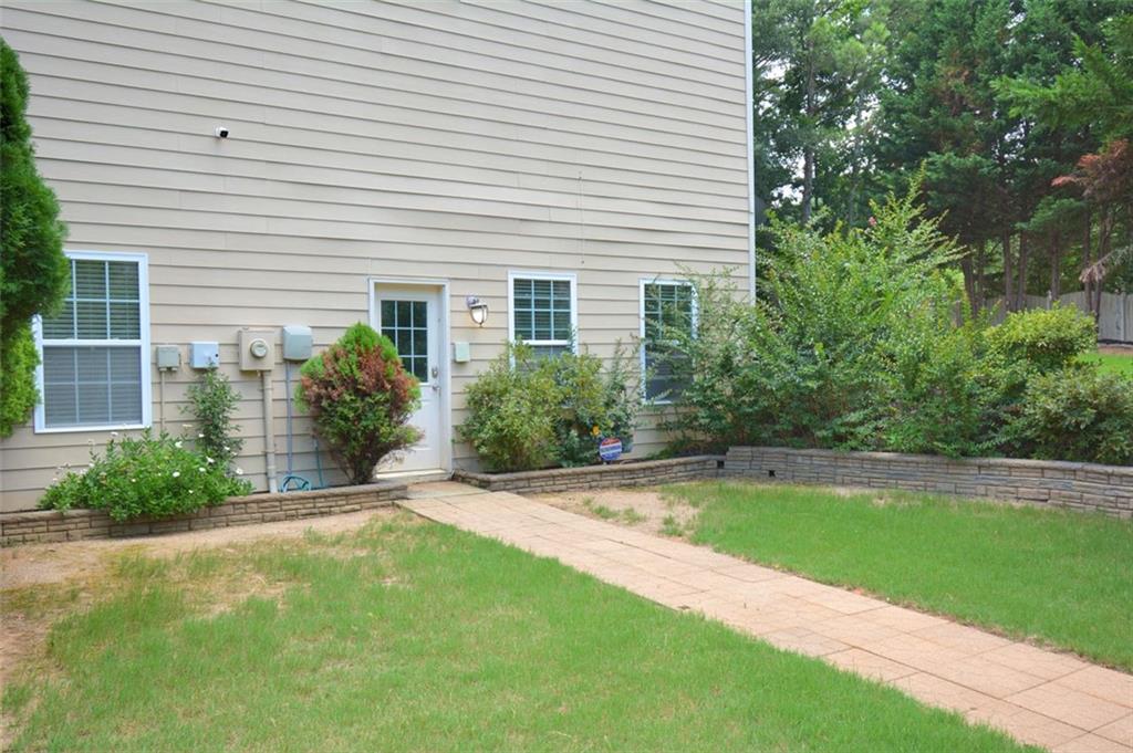 618 Tradwell Place Northeast, Unit BSMT Dacula, GA 30019 - Photo 19 of 20 a view of a backyard with swimming pool