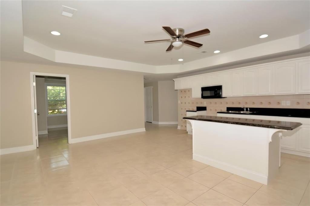 618 Tradwell Place Northeast, Unit BSMT Dacula, GA 30019 - Photo 3 of 20 a view of kitchen with sink and microwave