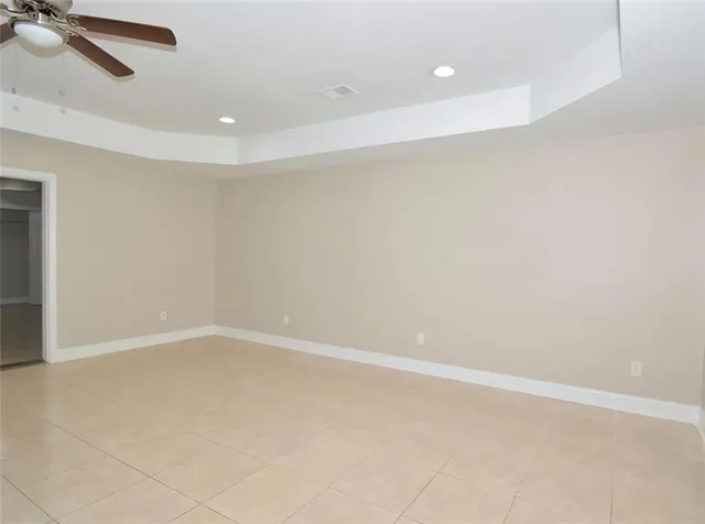 an empty room with a empty space and windows