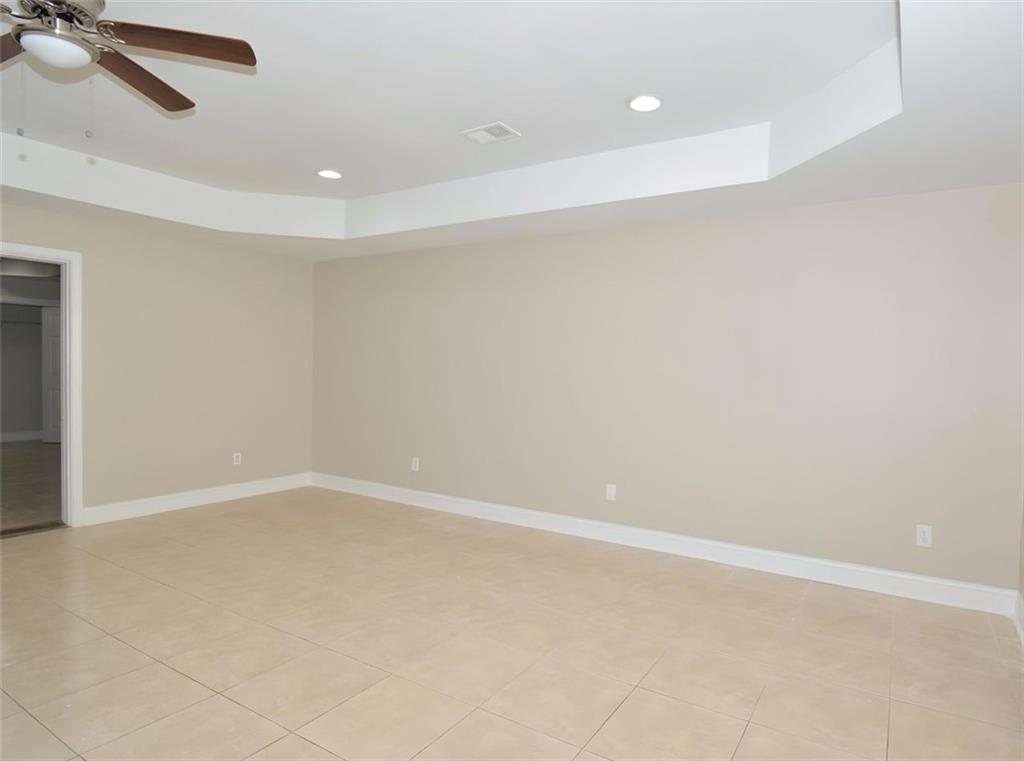 618 Tradwell Place Northeast, Unit BSMT Dacula, GA 30019 - Photo 4 of 20 an empty room with a empty space and windows