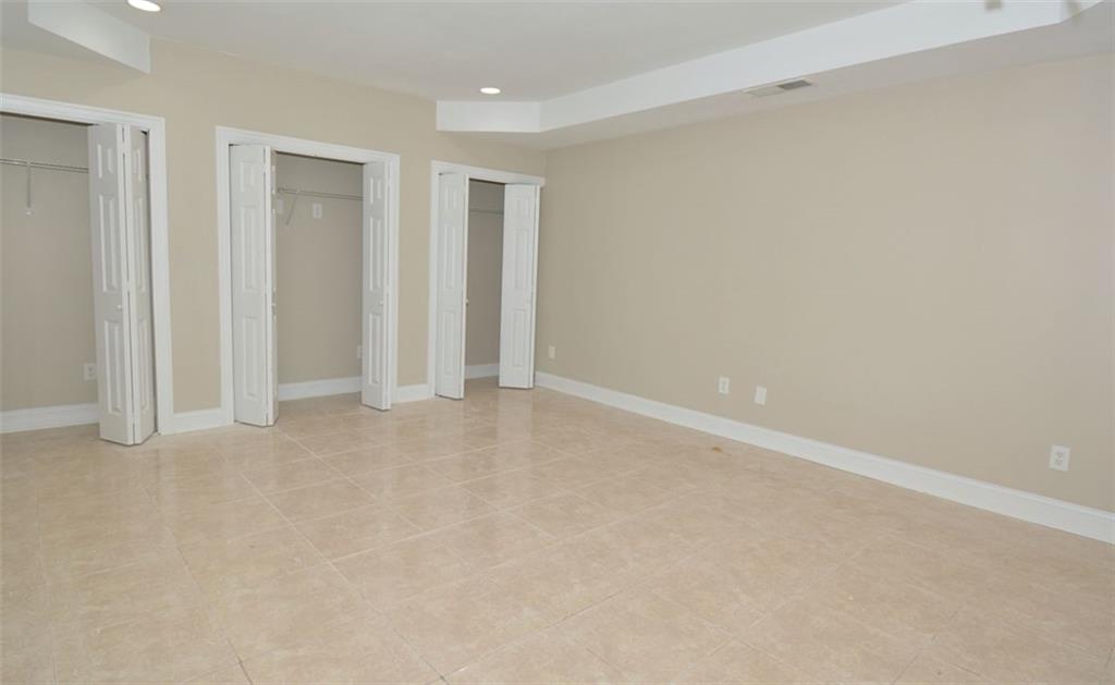 618 Tradwell Place Northeast, Unit BSMT Dacula, GA 30019 - Photo 7 of 20 a view of an empty room