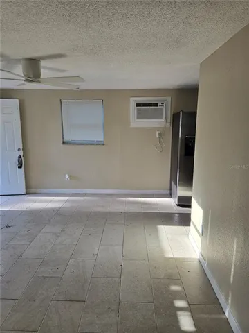 a view of a road with plants and trees