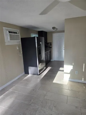 a kitchen with stainless steel appliances granite countertop wooden cabinets a granite counter and a sink