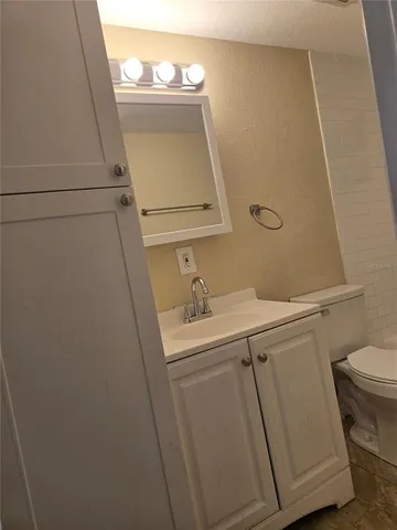 a view of a livingroom with an empty space and a window