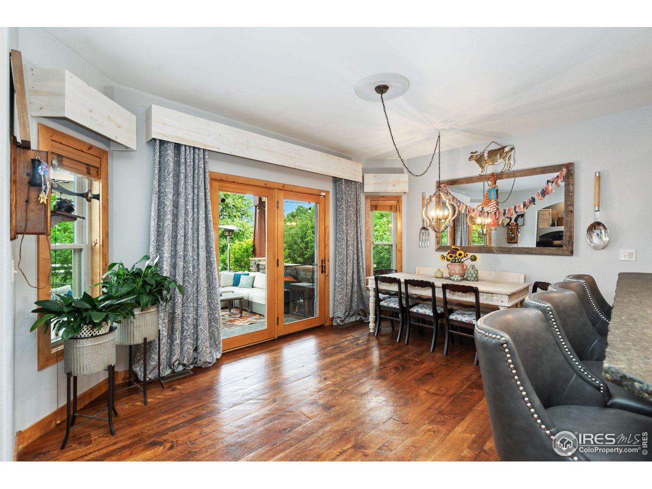 8265 Spinnaker Bay Drive Windsor, CO 80528 - Photo 11 of 40 a living room with furniture windows and wooden floor