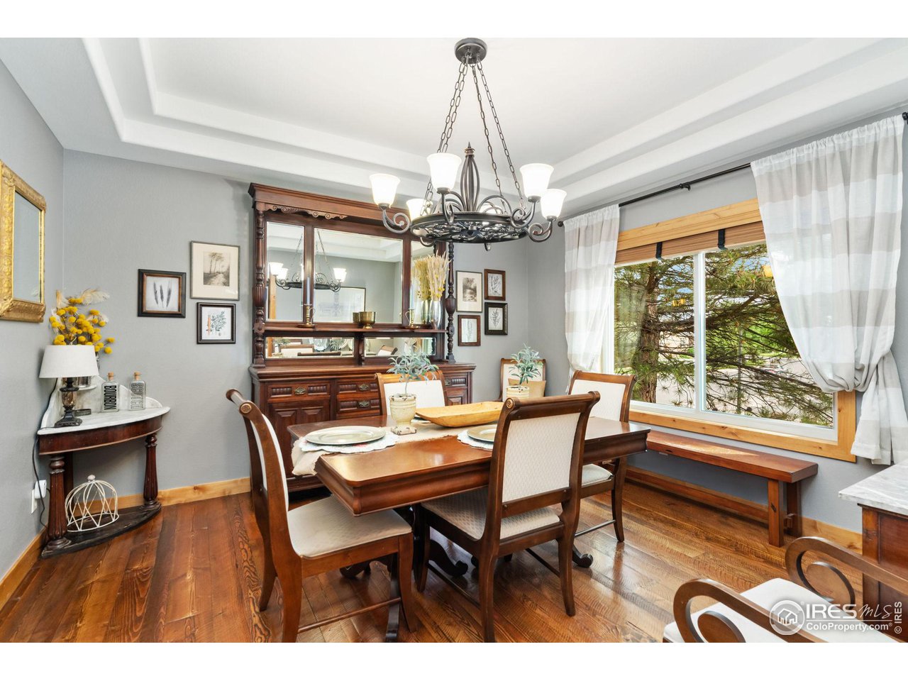 8265 Spinnaker Bay Drive Windsor, CO 80528 - Photo 13 of 40 a view of a dining room with furniture window and outside view