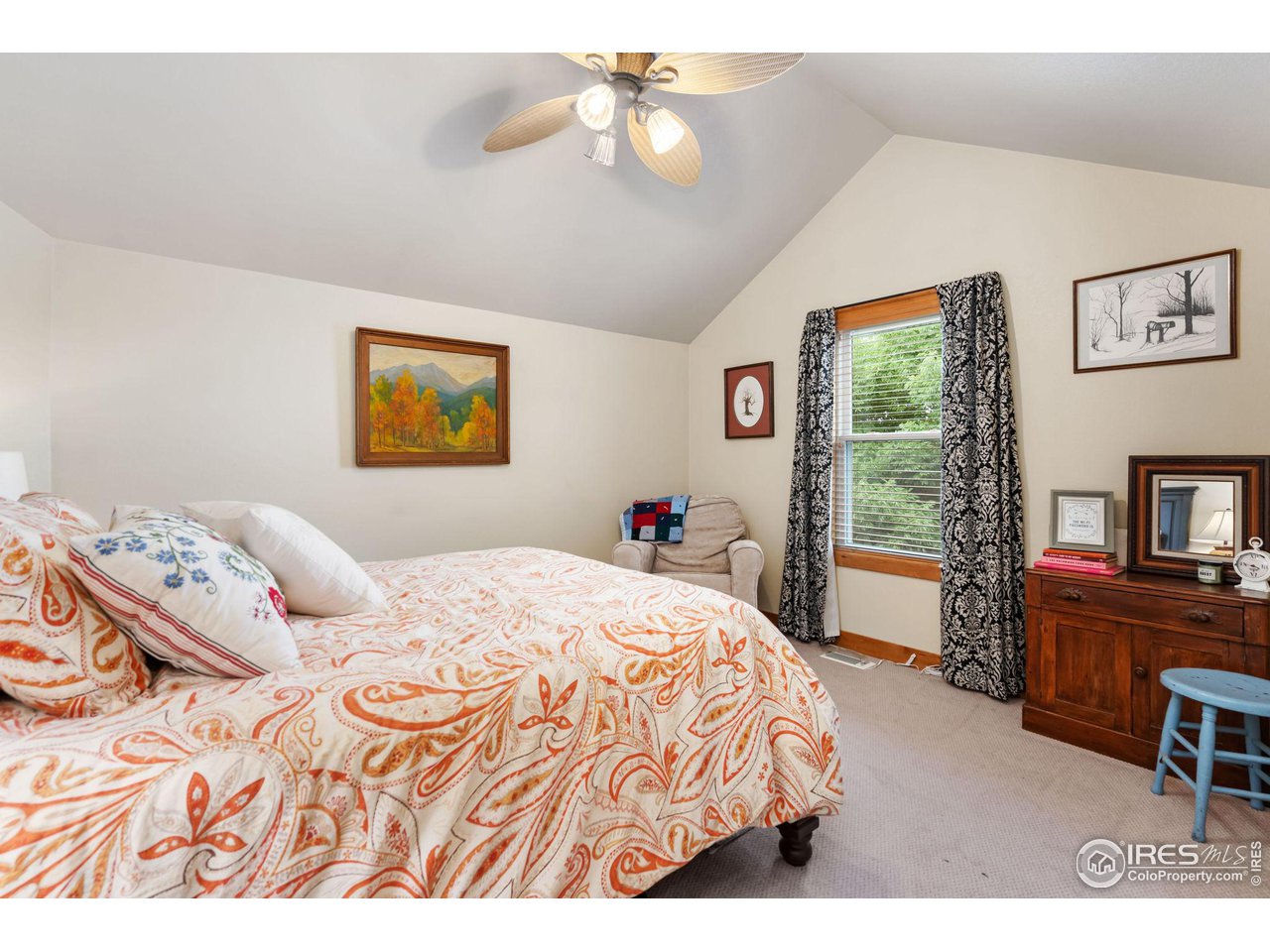 8265 Spinnaker Bay Drive Windsor, CO 80528 - Photo 17 of 40 a bedroom with a bed dresser and a window