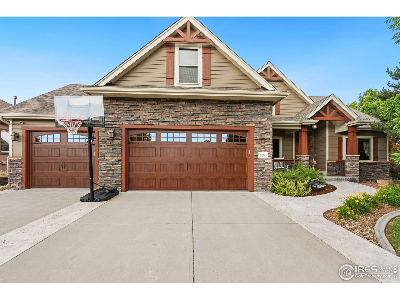 8265 Spinnaker Bay Drive Windsor, CO 80528 - Photo 2 of 40 a front view of a house with yard