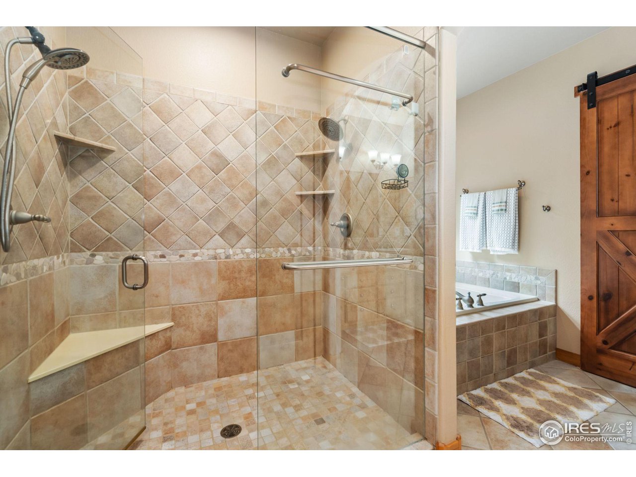8265 Spinnaker Bay Drive Windsor, CO 80528 - Photo 24 of 40 a bathroom with a sink and a mirror