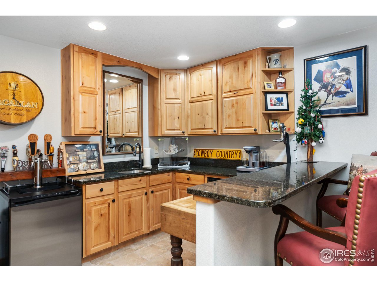 8265 Spinnaker Bay Drive Windsor, CO 80528 - Photo 34 of 40 a kitchen with sink a window and cabinets