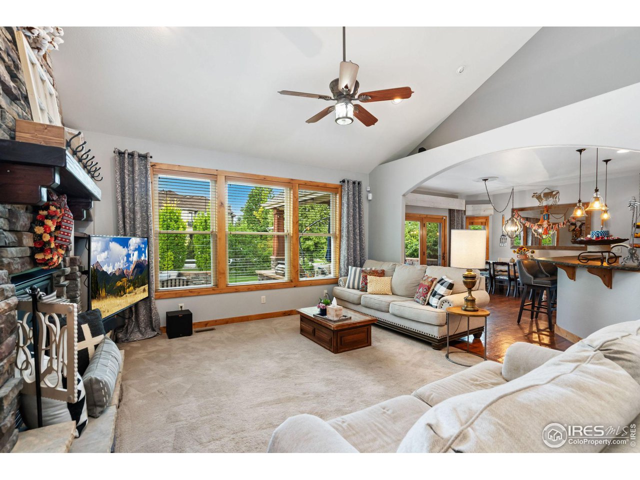 8265 Spinnaker Bay Drive Windsor, CO 80528 - Photo 6 of 40 a living room with furniture and a large window