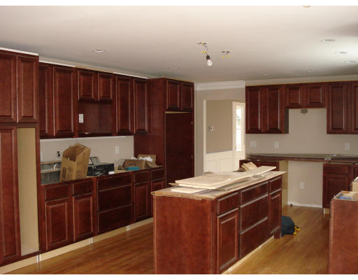 76 Prospect Street Canton, MA 02021 - Photo 2 of 6 a kitchen with stainless steel appliances granite countertop a stove a refrigerator a sink and dishwasher