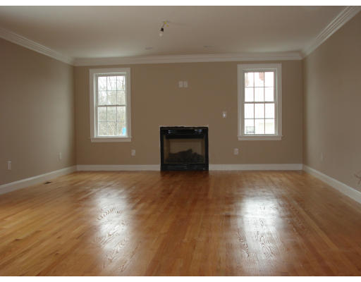 76 Prospect Street Canton, MA 02021 - Photo 5 of 6 a view of an empty room with wooden floor and a window
