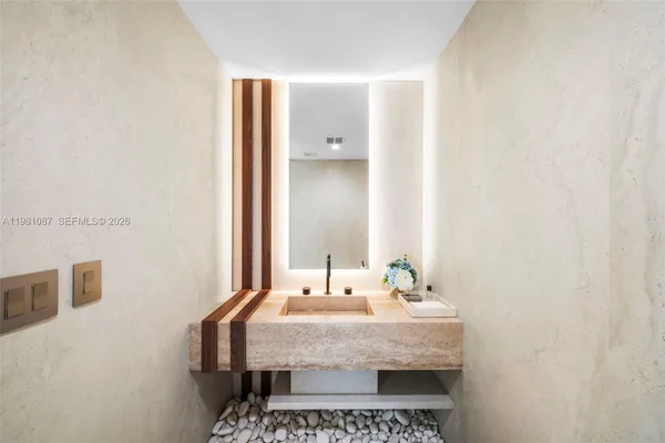 a bathroom with a sink and a mirror
